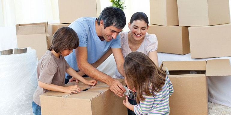 Family packing belongings for moving